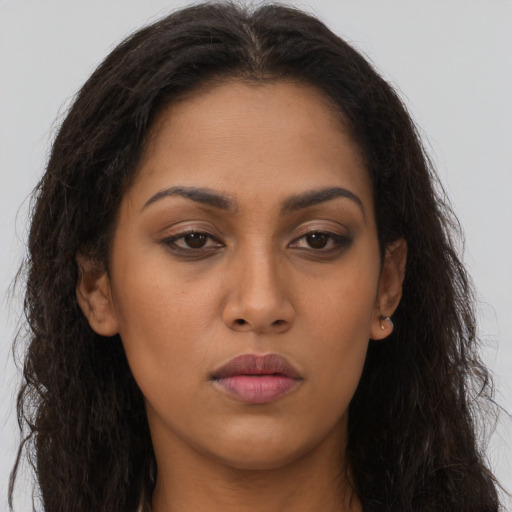 Neutral latino young-adult female with long  brown hair and brown eyes