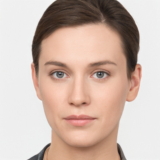 Neutral white young-adult female with short  brown hair and brown eyes