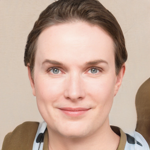 Joyful white young-adult female with short  brown hair and grey eyes