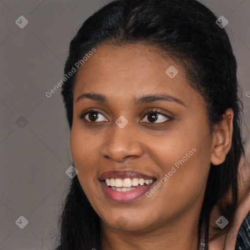 Joyful latino young-adult female with long  black hair and brown eyes