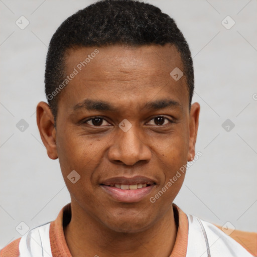 Joyful black young-adult male with short  brown hair and brown eyes