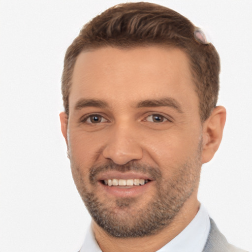 Joyful white young-adult male with short  brown hair and brown eyes