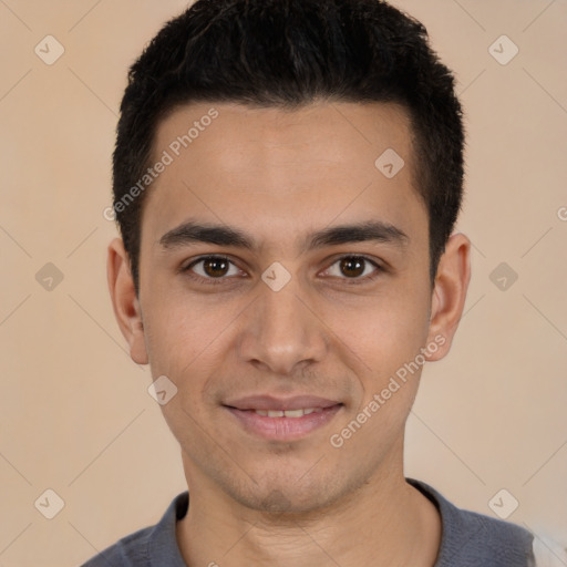 Joyful white young-adult male with short  black hair and brown eyes