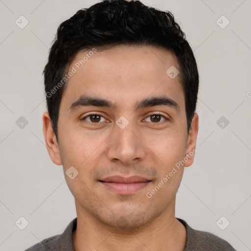 Joyful white young-adult male with short  black hair and brown eyes