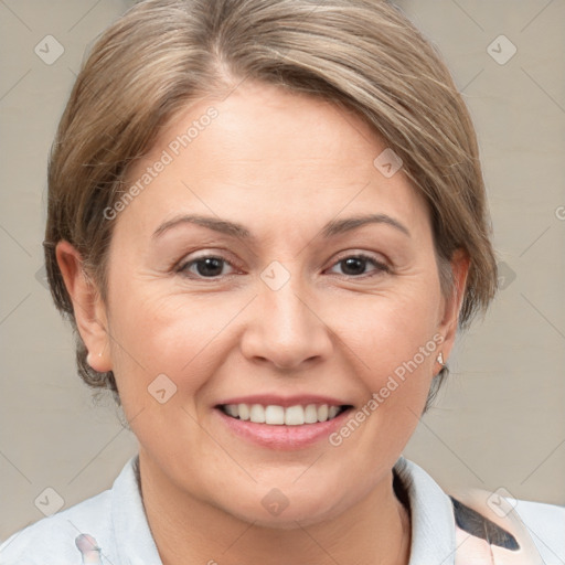 Joyful white adult female with medium  brown hair and grey eyes