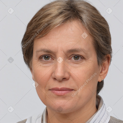 Joyful white adult female with short  brown hair and brown eyes