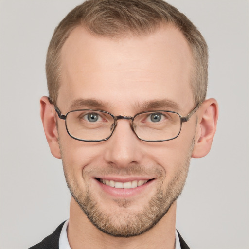 Joyful white adult male with short  brown hair and grey eyes