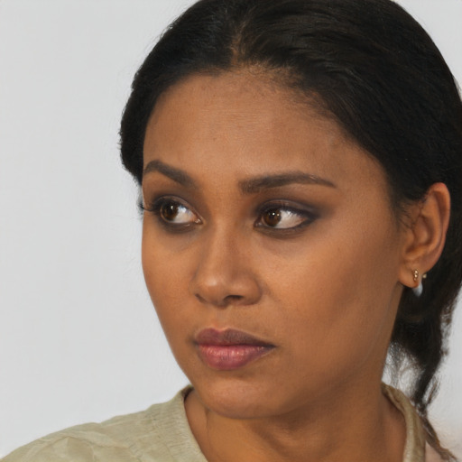 Neutral black young-adult female with short  black hair and brown eyes
