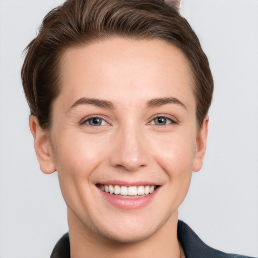 Joyful white young-adult female with short  brown hair and grey eyes