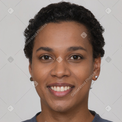 Joyful latino young-adult female with short  black hair and brown eyes