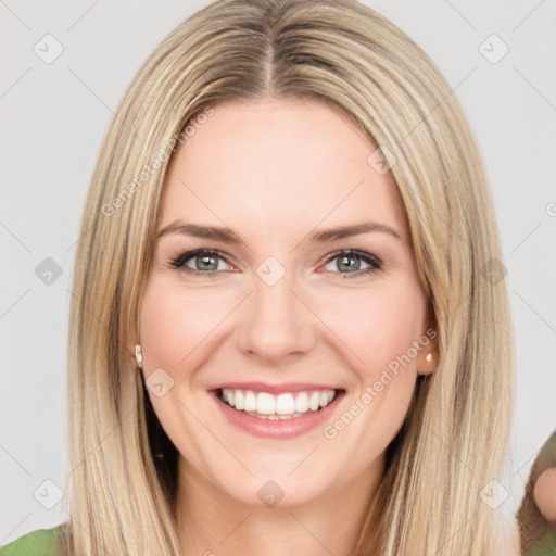 Joyful white young-adult female with long  brown hair and green eyes