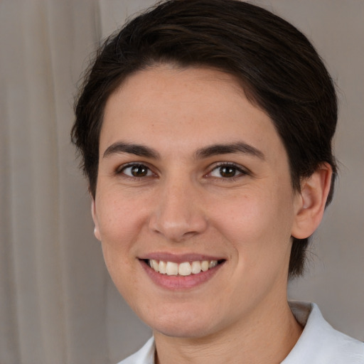 Joyful white young-adult female with medium  brown hair and brown eyes