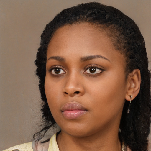 Neutral black young-adult female with medium  black hair and brown eyes