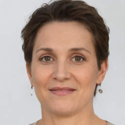 Joyful white adult female with short  brown hair and brown eyes