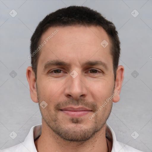 Joyful white young-adult male with short  brown hair and brown eyes