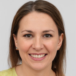 Joyful white young-adult female with medium  brown hair and brown eyes