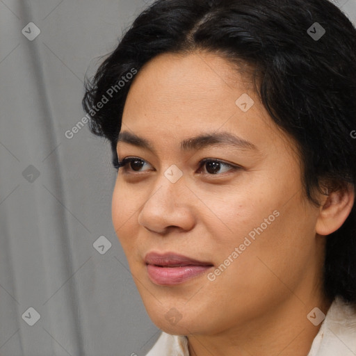 Joyful asian young-adult female with medium  black hair and brown eyes