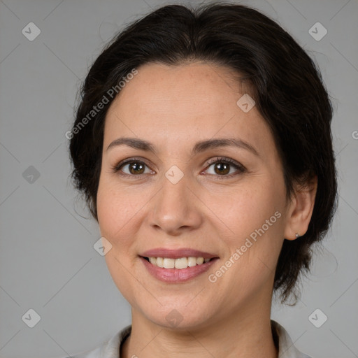 Joyful white adult female with medium  brown hair and brown eyes