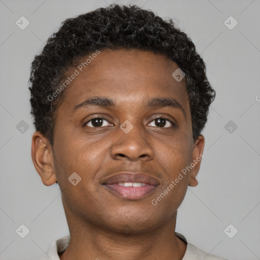 Joyful black young-adult male with short  brown hair and brown eyes