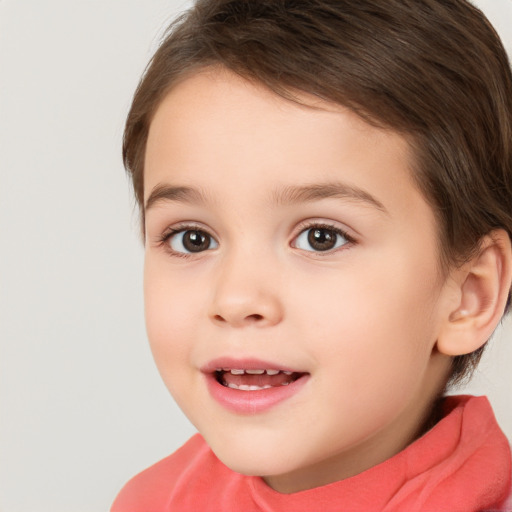 Joyful white child female with short  brown hair and brown eyes