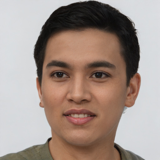 Joyful asian young-adult male with short  brown hair and brown eyes