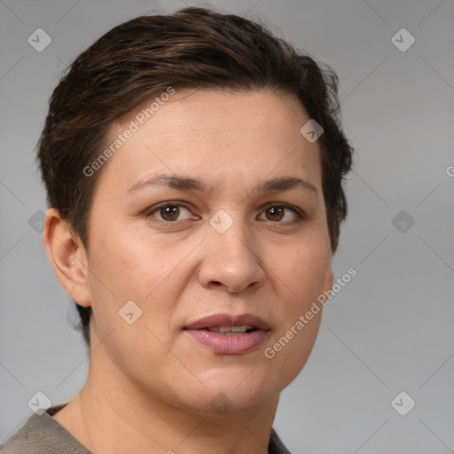 Joyful white adult female with short  brown hair and grey eyes