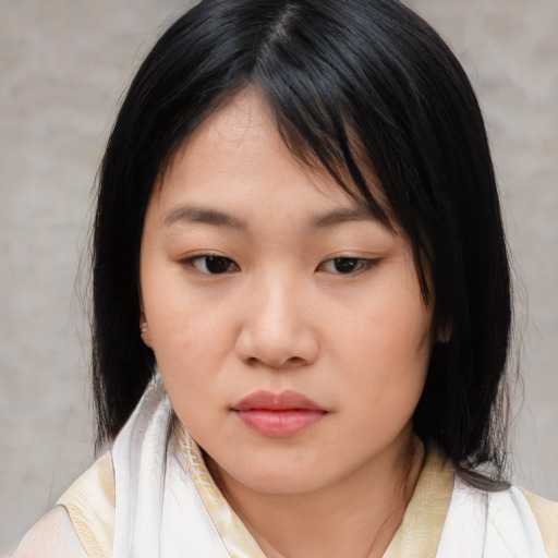 Neutral asian young-adult female with medium  black hair and brown eyes