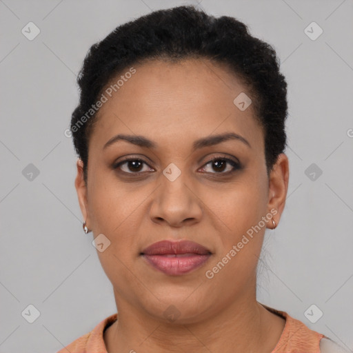 Joyful black young-adult female with short  brown hair and brown eyes