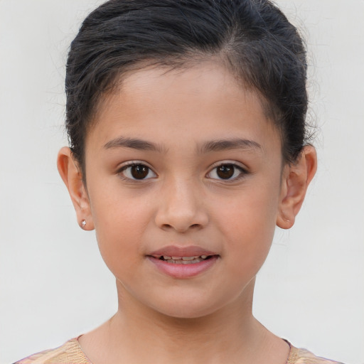 Joyful white child female with short  brown hair and brown eyes