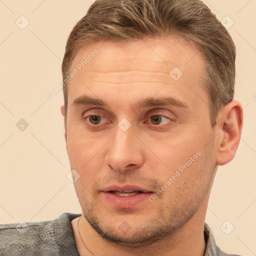 Joyful white adult male with short  brown hair and brown eyes