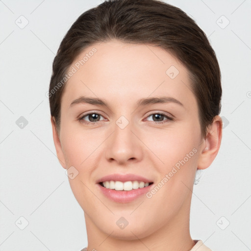 Joyful white young-adult female with short  brown hair and brown eyes