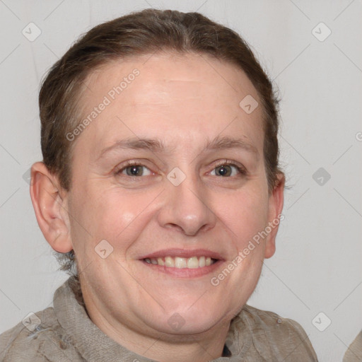 Joyful white adult female with short  brown hair and grey eyes