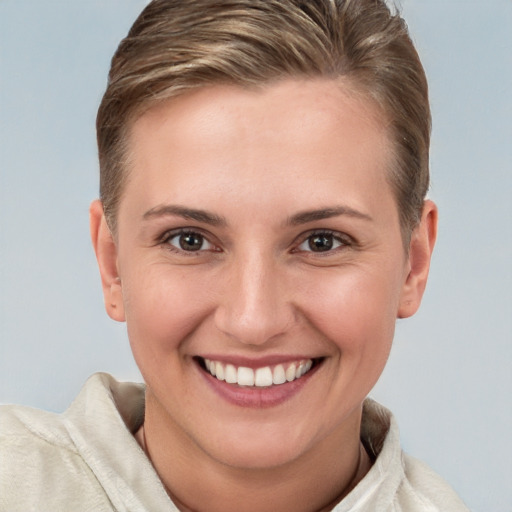 Joyful white young-adult female with short  brown hair and brown eyes