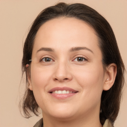 Joyful white young-adult female with medium  brown hair and brown eyes