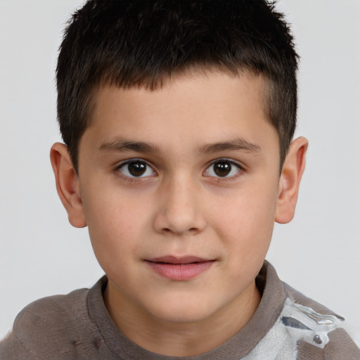 Joyful white child male with short  brown hair and brown eyes