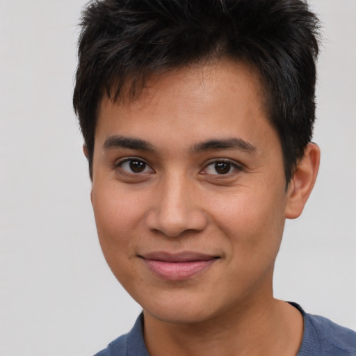 Joyful asian young-adult male with short  brown hair and brown eyes