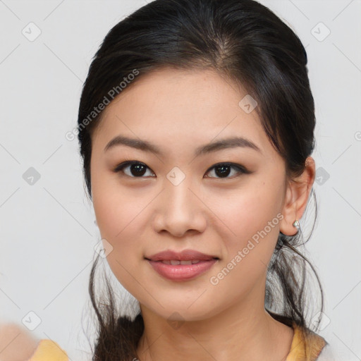 Joyful asian young-adult female with medium  brown hair and brown eyes