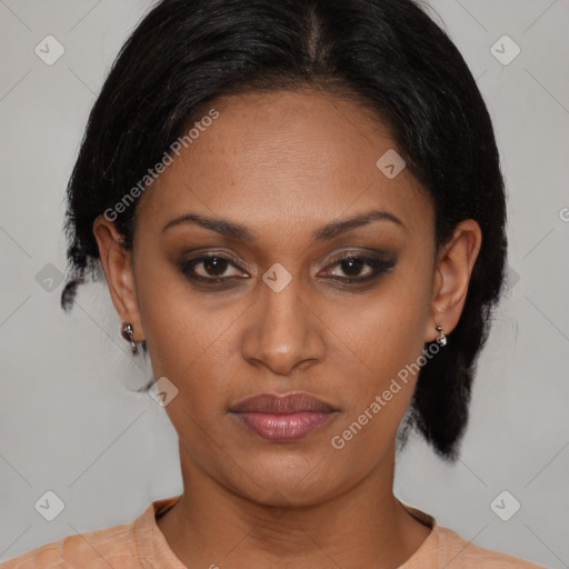 Joyful black young-adult female with medium  black hair and brown eyes