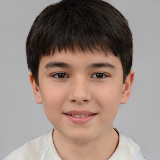 Joyful white child male with short  brown hair and brown eyes