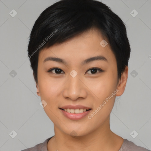 Joyful asian young-adult female with short  black hair and brown eyes