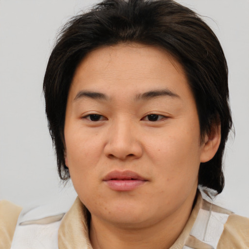 Joyful asian young-adult female with medium  brown hair and brown eyes