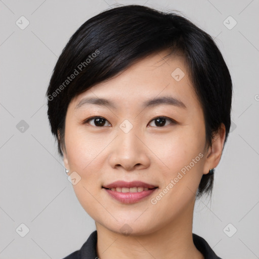 Joyful asian young-adult female with medium  black hair and brown eyes