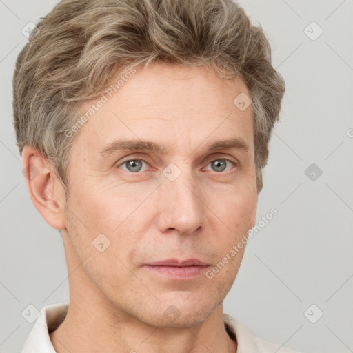 Neutral white adult male with short  brown hair and grey eyes