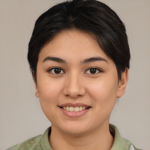 Joyful asian young-adult female with short  brown hair and brown eyes