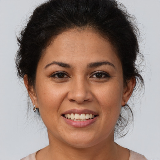 Joyful white young-adult female with medium  brown hair and brown eyes