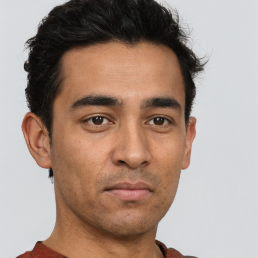 Neutral white young-adult male with short  black hair and brown eyes