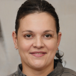 Joyful white adult female with short  brown hair and brown eyes