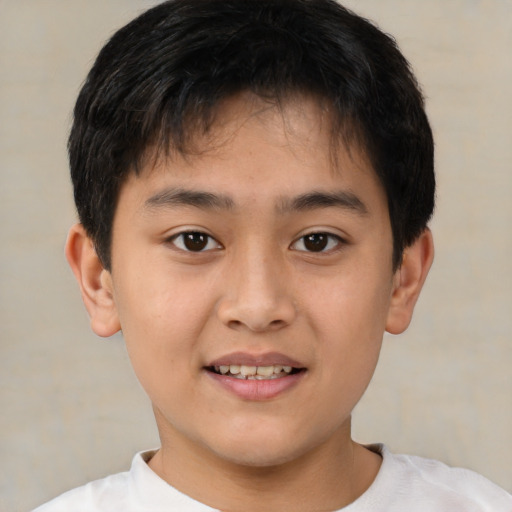Joyful white child male with short  brown hair and brown eyes