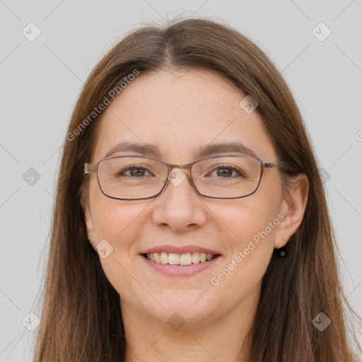 Joyful white adult female with long  brown hair and brown eyes