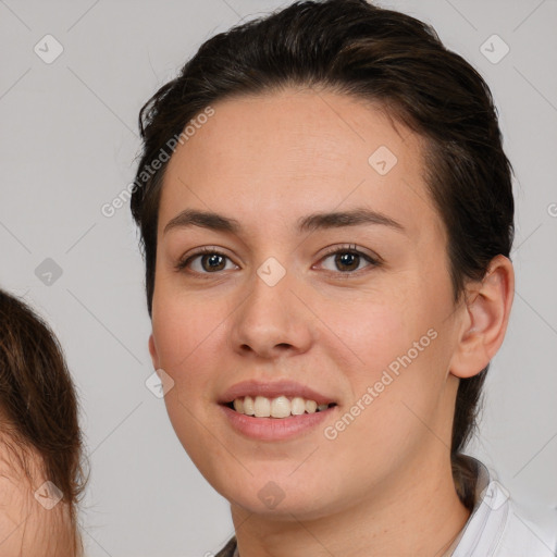 Joyful white young-adult female with medium  brown hair and brown eyes